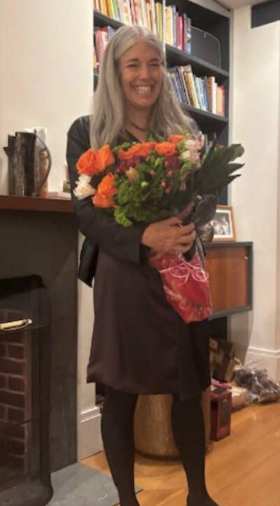 The author holding flowers are her first co-regulation party. (Courtesy Nancy Rappaport)