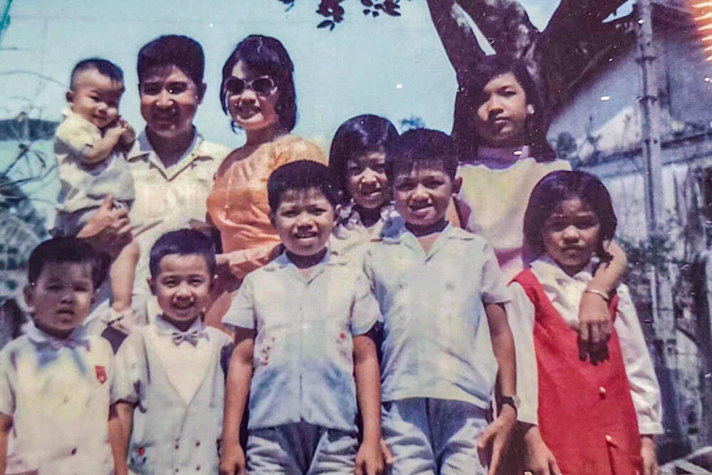 The Truong Le family, with Van's father, Minh Thanh Le, top left, and his mother, Van Tuong Do, with eight of their children in 1960s Vietnam. (Courtesy of Mary Truong)