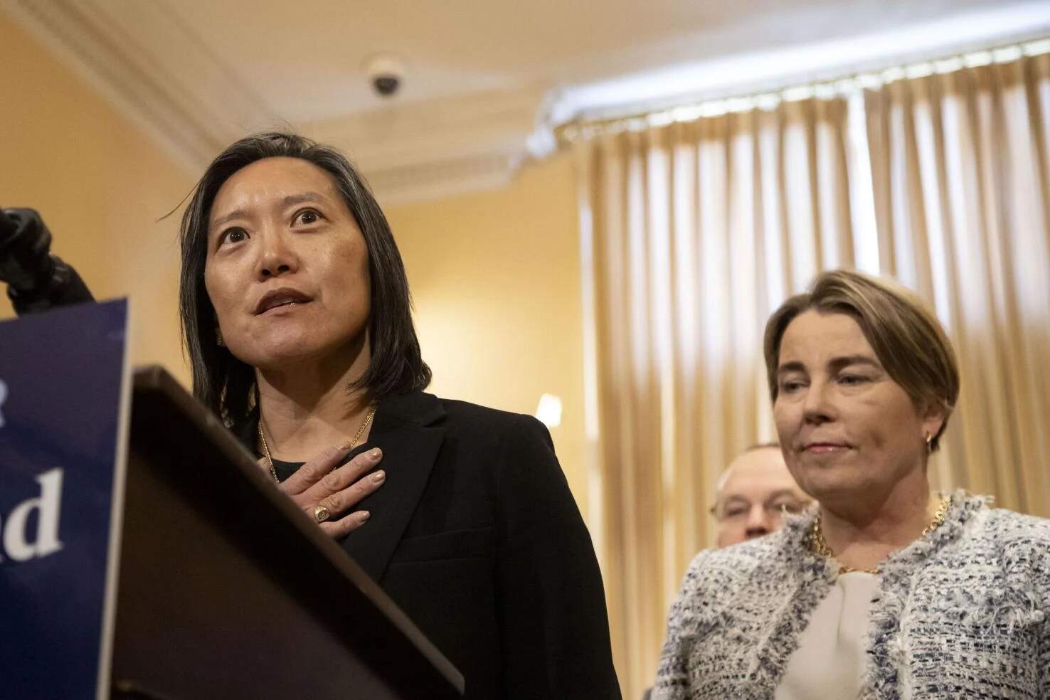 Economic Development Secretary Yvonne Hao addresses reporters on April 9, 2025, flanked by Gov. Maura Healey. (Chris Lisinski/SHNS)