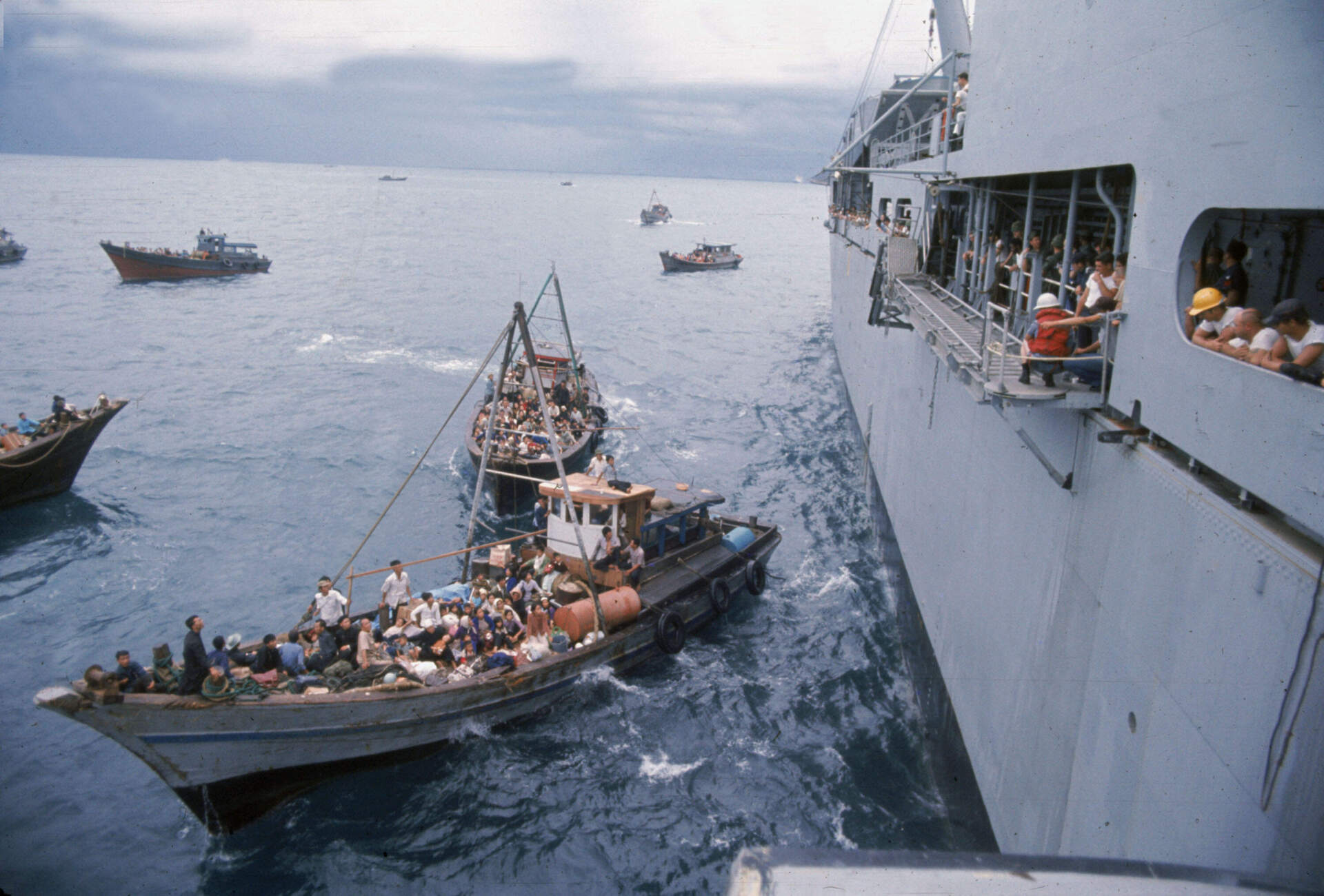 South Vietnamese refugees in boats approach a U.S. war ship to seek refuge from the invading force from the North April 1975 in the South China Sea near Saigon. (Dirck Halstead/Getty Images)