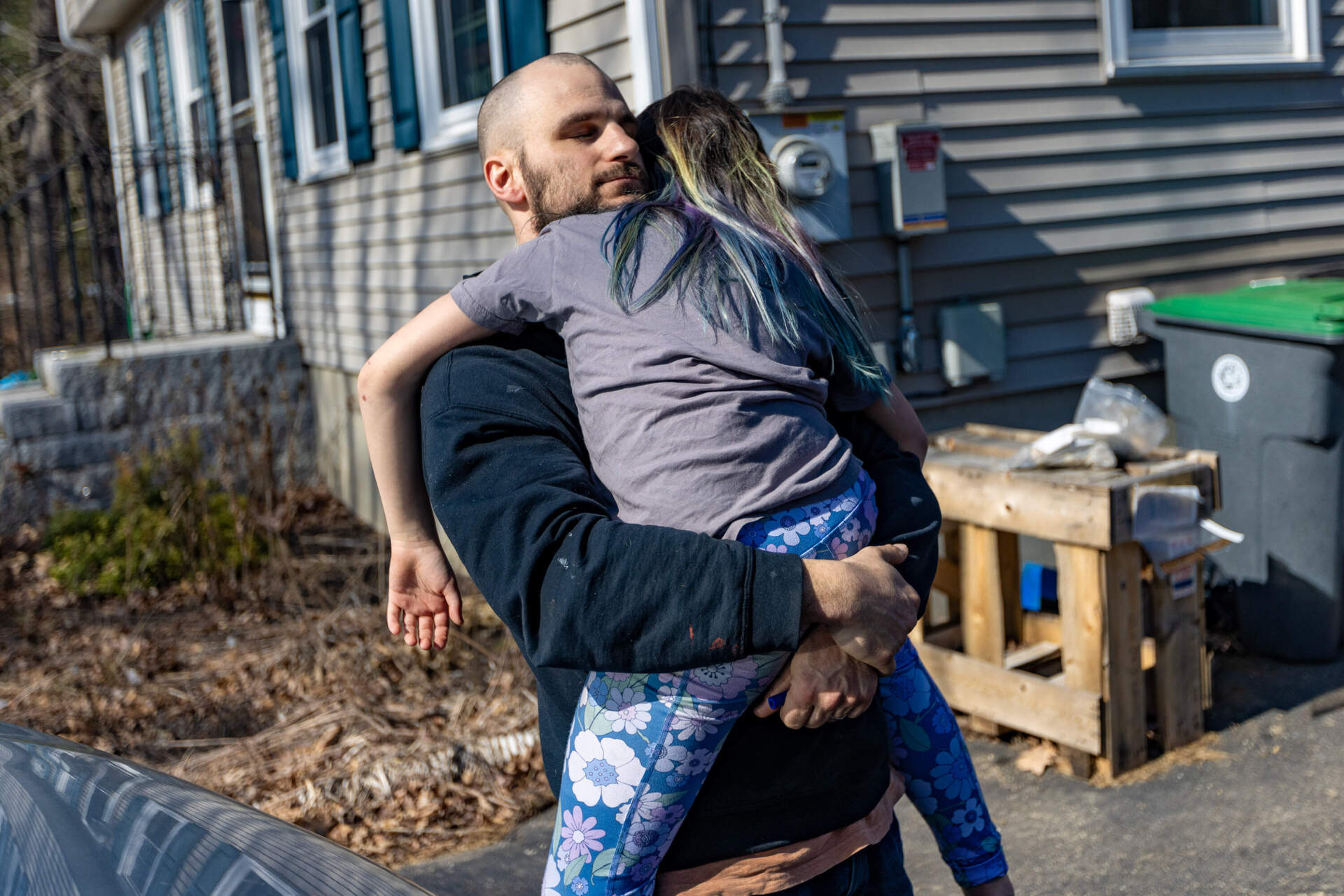 Ian consoles Emily after a dispute with a sibling. (Jesse Costa/WBUR)