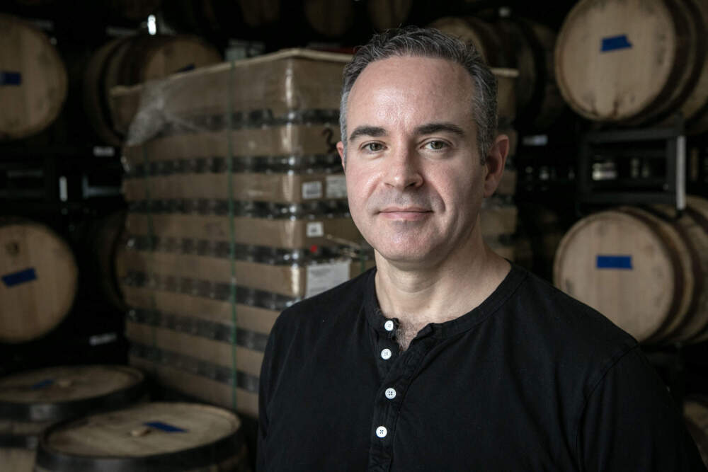 The owner Rodrigo Vargas at American Vinegar Works in Worcester. (Robin Lubbock / Wbur)