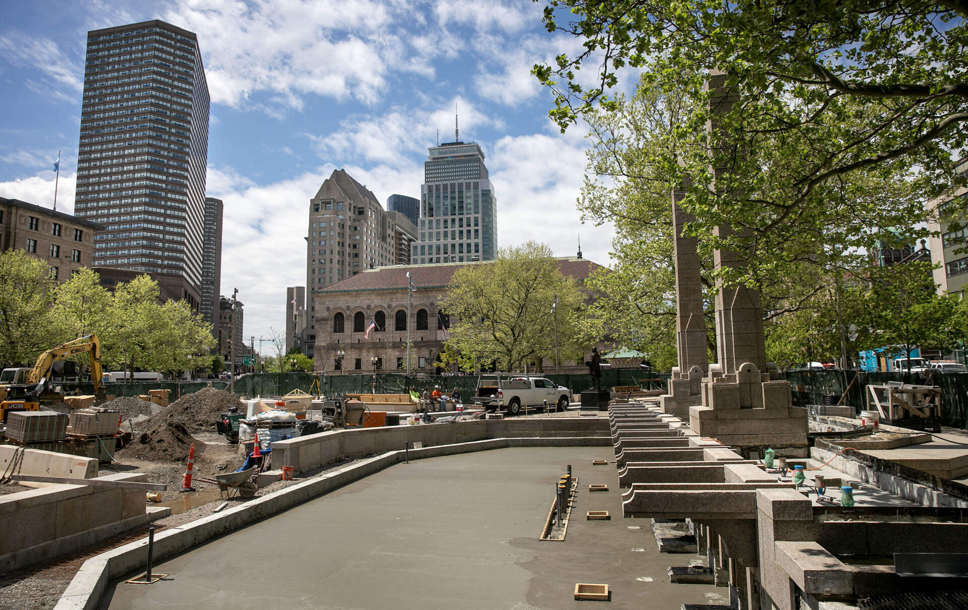 The fountain and lawn area of the new Copley Square Park under construction. (Robin Lubbock/WBUR)