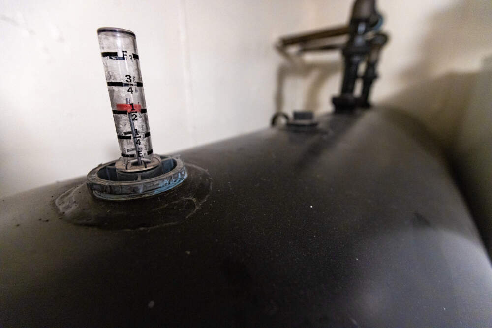The oil tank in Lillie Bryan’s basement reading at half full. (Jesse Costa/WBUR)