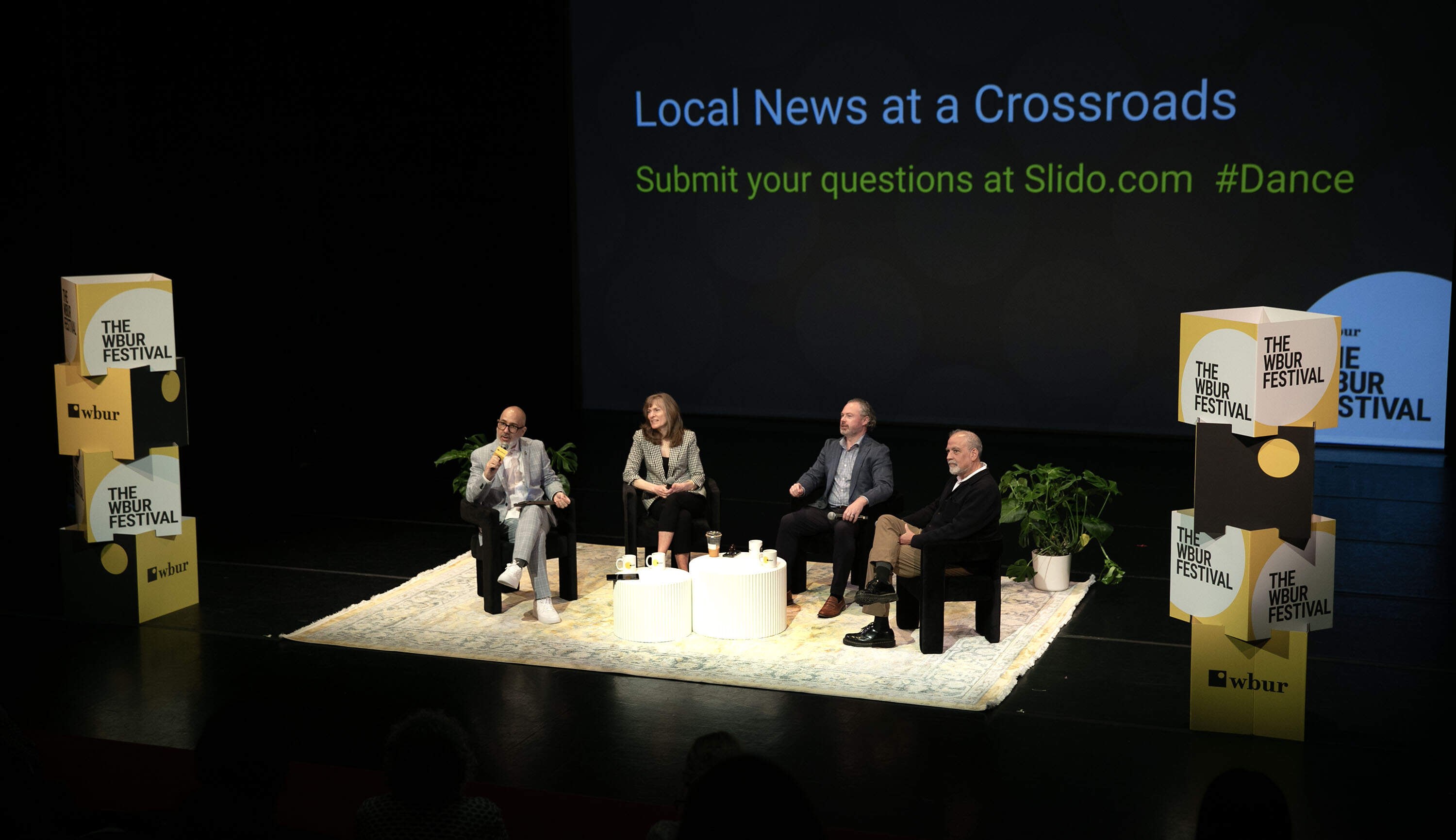 WBUR's chief content officer Victor Hernandez introduces the "Local News at a Crossroads" session at The WBUR Festival on Friday. (Robin Lubbock/WBUR)