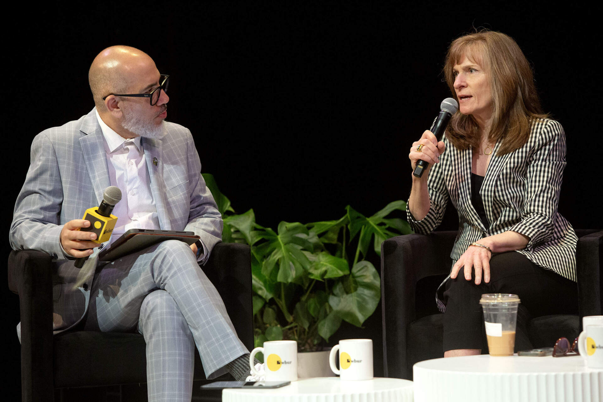 WBUR chief content officer Victor Hernandez talks with WCVB news director Margaret Cronan at The WBUR Festival on Friday. (Robin Lubbock/WBUR)