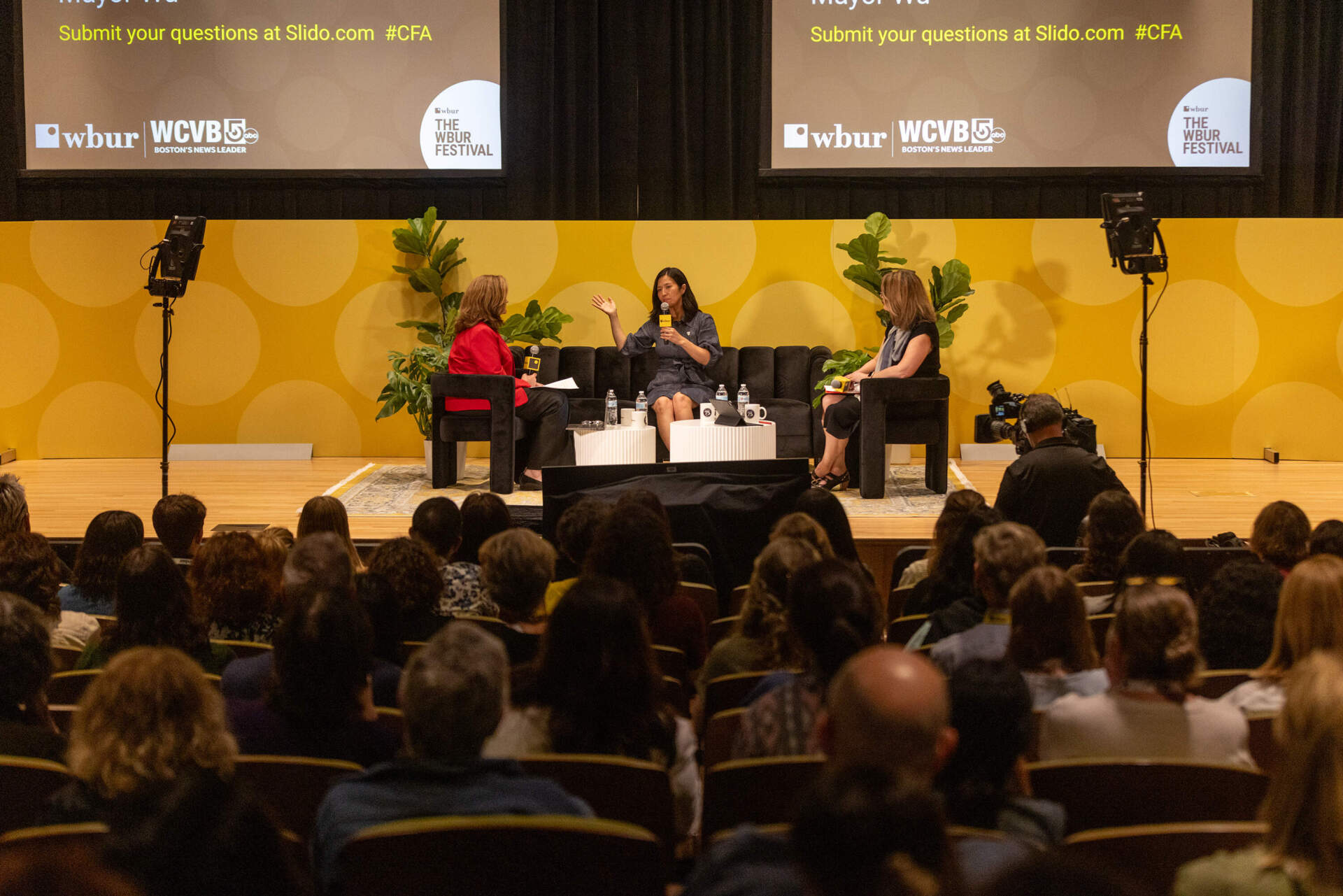 WCVB's Sharman Sacchetti, Boston Mayor Michelle Wu and WBUR's Tiziana Dearing on stage at The WBUR Festival. (Jesse Costa/WBUR)