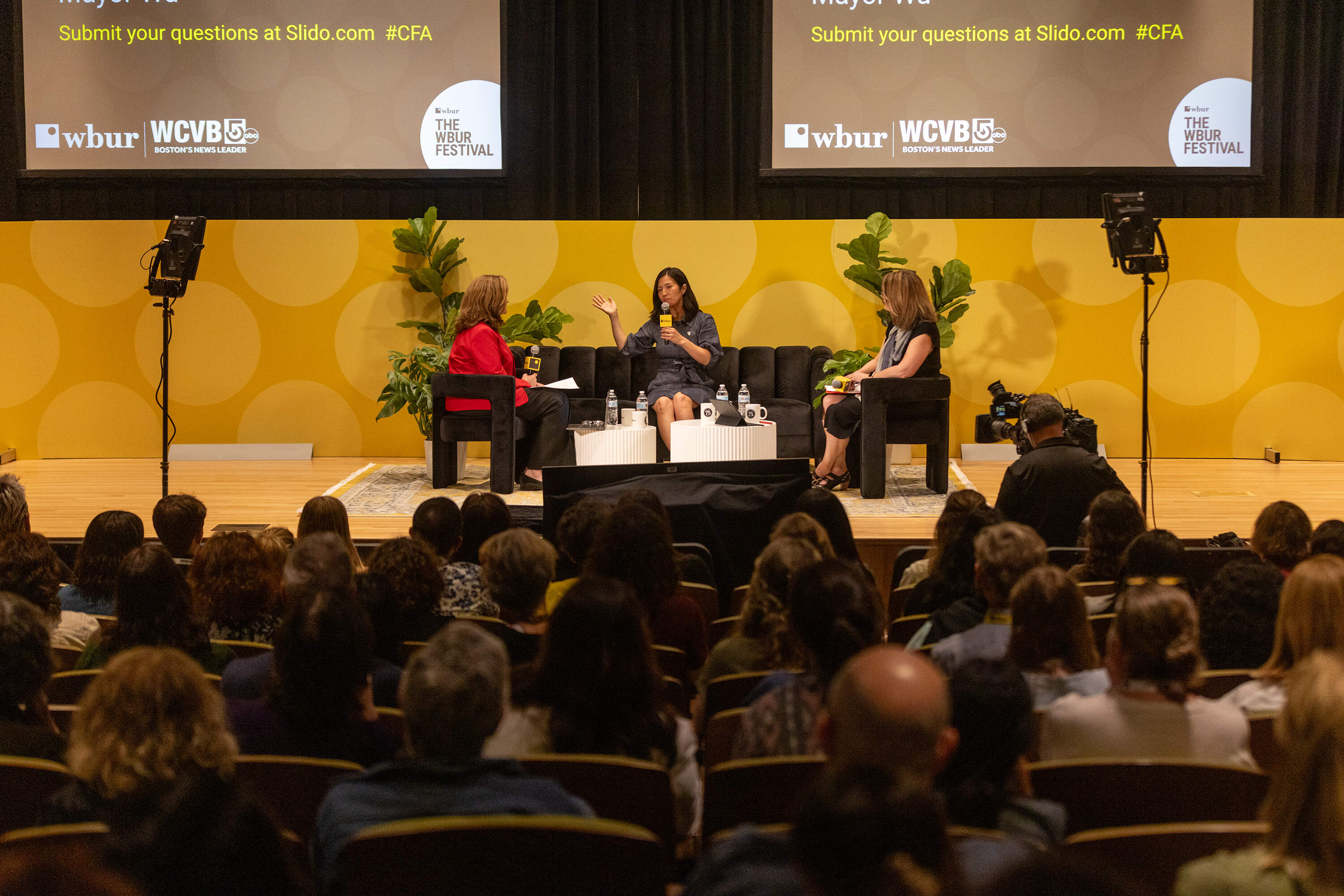 WCVB's Sharman Sacchetti, Boston Mayor Michelle Wu and WBUR's Tiziana Dearing on stage at The WBUR Festival. (Jesse Costa/WBUR)