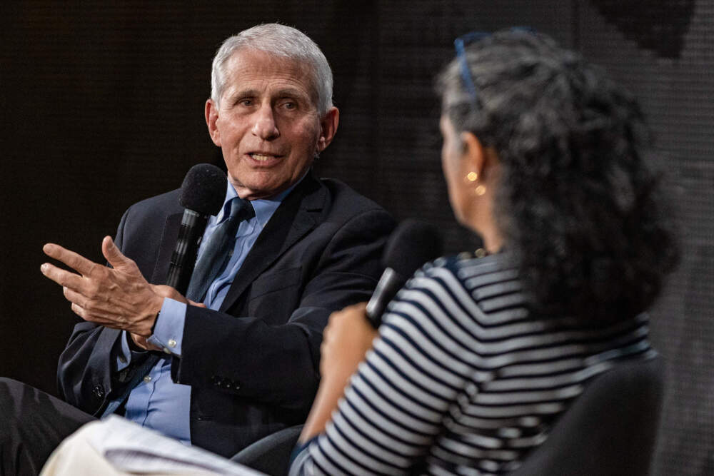 Dr. Anthony Fauci speaks to On Point host Meghna Chakrabarti on stage during an event at CitySpace last October. (Jesse Costa/WBUR)
