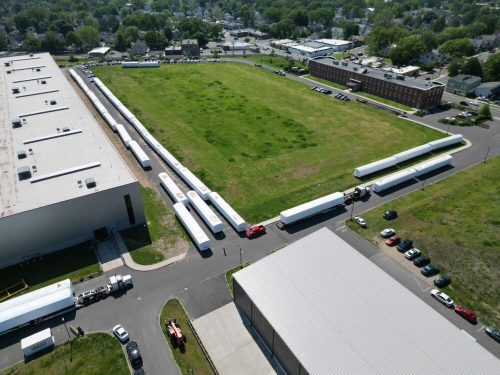 WHITE-WRAAPED TRAINS SIT IN A LINE AT THE CRRC'S FACILITY IN SPRINGFIELD. (Courtesy of the mbta)