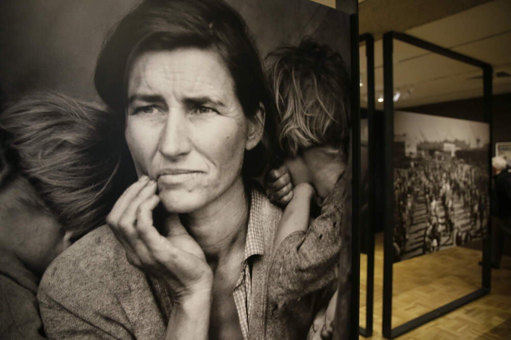 The iconic photograph Migrant Mother looks out at the exhibit "Dorothea Lange: Politics of Seeing," at the Oakland Museum of California in Oakland, Calif in 2017. (Eric Risberg/AP)