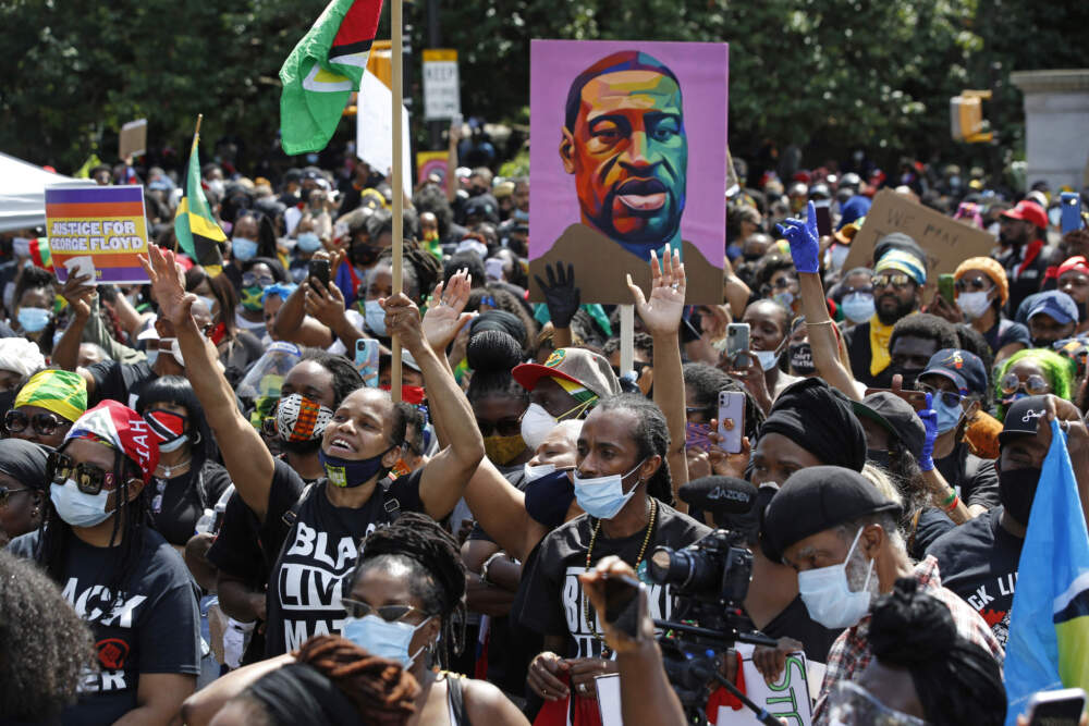 People participate in a Caribbean-led Black Lives Matter rally on June 14, 2020, at Brooklyn's Grand Army Plaza in New York. (Kathy Willen/AP)