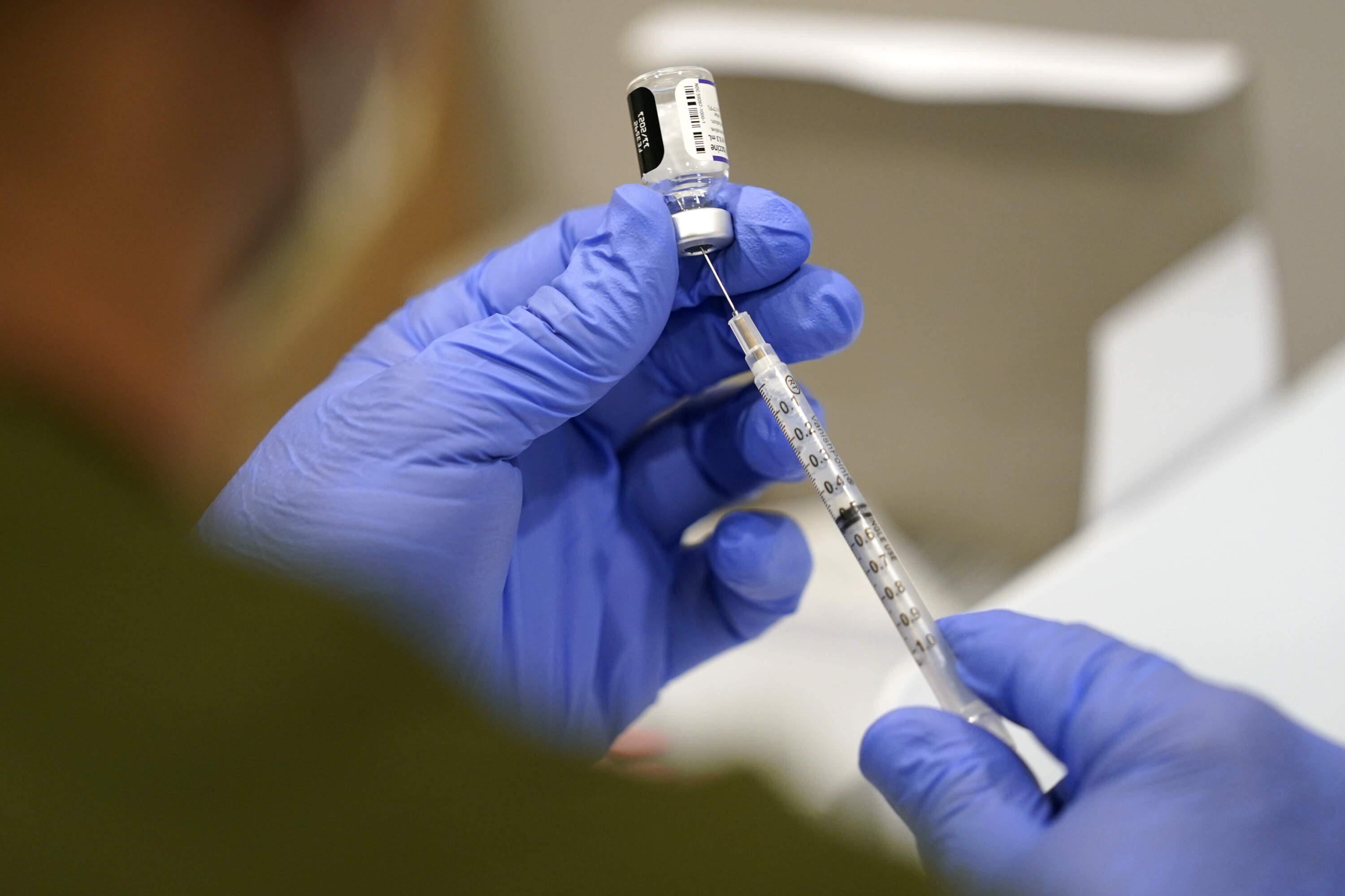 A healthcare worker fills a syringe with the Pfizer COVID-19 vaccine at Jackson Memorial Hospital on Oct. 5, 2021, in Miami. (Lynne Sladky/AP)