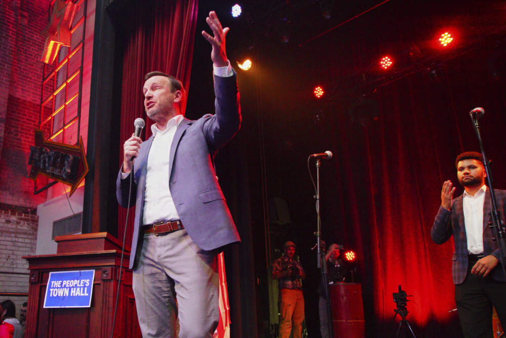 Sen. Chris Murphy, D-Conn., speaks from the stage of the Haw River Ball Room during a town hall in Saxapahaw, N.C., Thursday, April 24, 2025, as Rep. Maxwell Frost, D-Fla., right, listens. (Allen G. Breed/AP)
