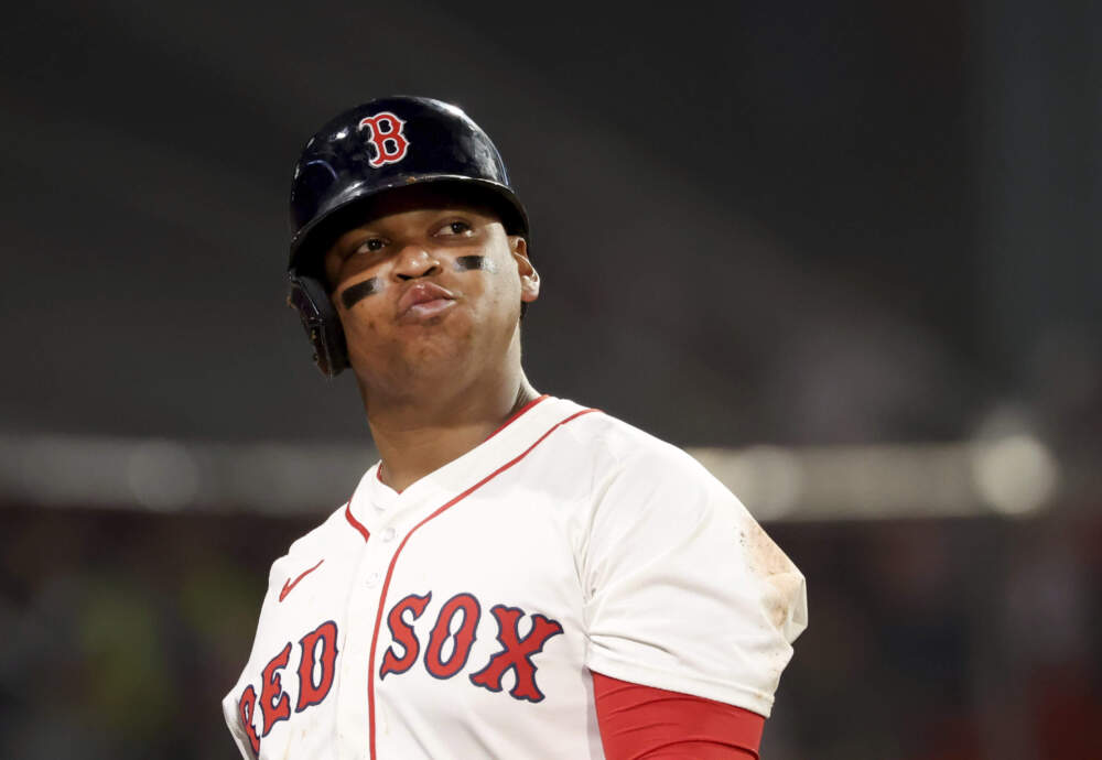Boston Red Sox designated hitter Rafael Devers reacts after striking out during the eighth inning of a baseball game against the Texas Rangers, Tuesday, May 6, 2025, in Boston. (AP Photo/Mark Stockwell)