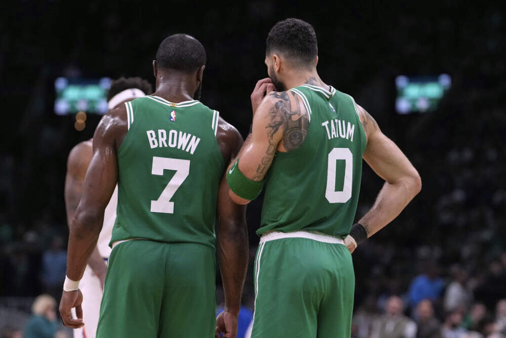 Boston Celtics forward Jayson Tatum (0) and guard Jaylen Brown (7) talk during the second half of Game 2 of an NBA basketball second-round playoff series against the New York Knicks, Wednesday, May 7, 2025, in Boston. (Charles Krupa/AP)