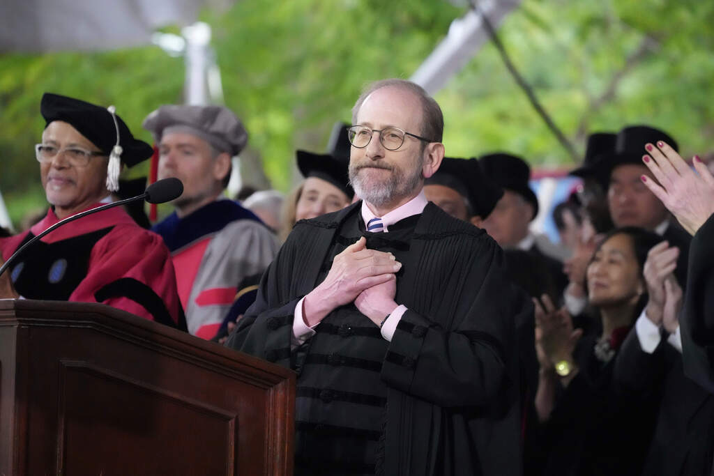 Harvard President Alan Garber acknowledges an extended round of applause during Harvard University's commencement ceremonies. (Charles Krupa/AP)