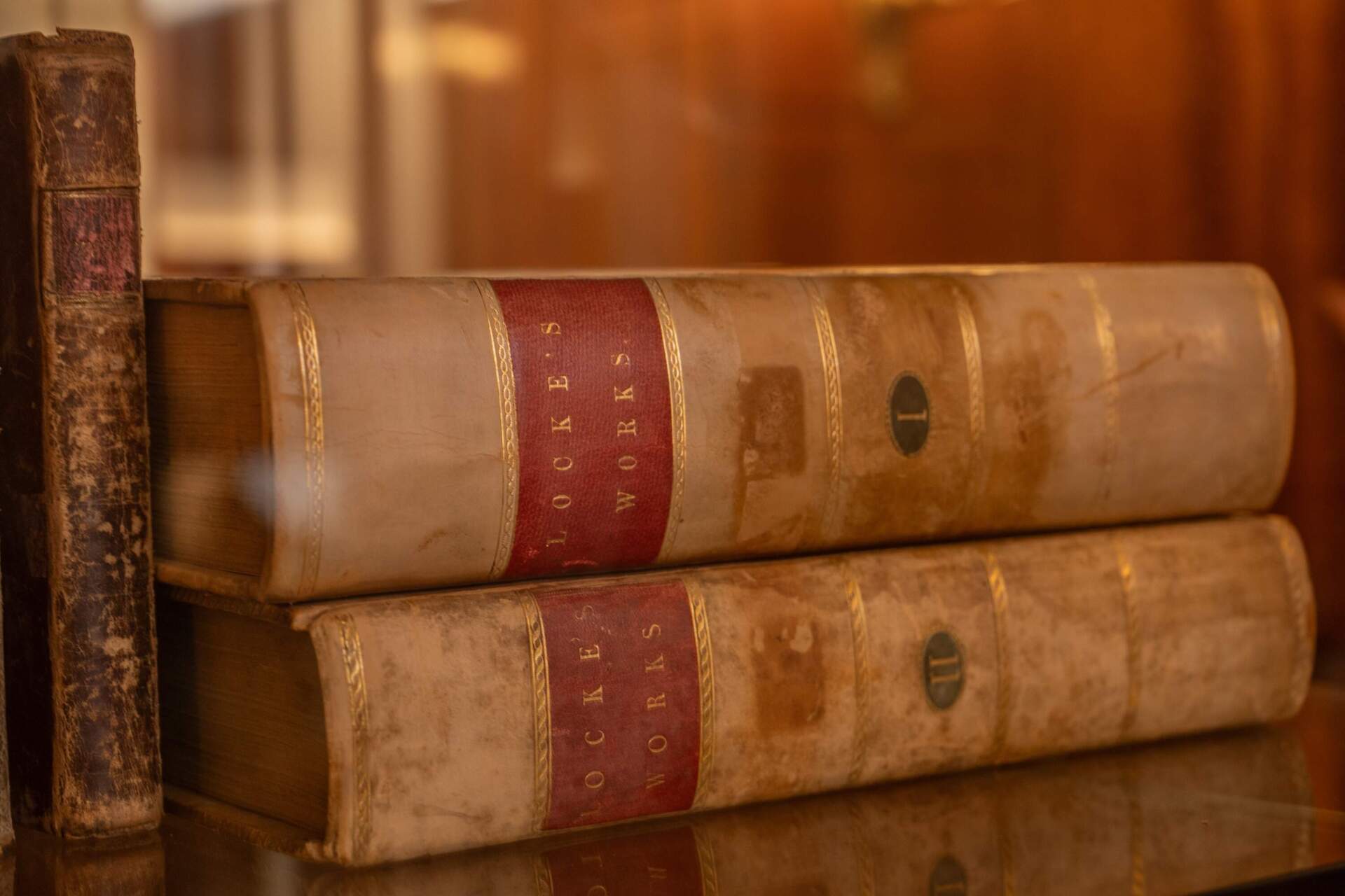 The volumes of the collected work of philosopher John Locke are among the books donated by Benjamin Franklin to the Franklin Public Library. (Sharon Brody/WBUR)