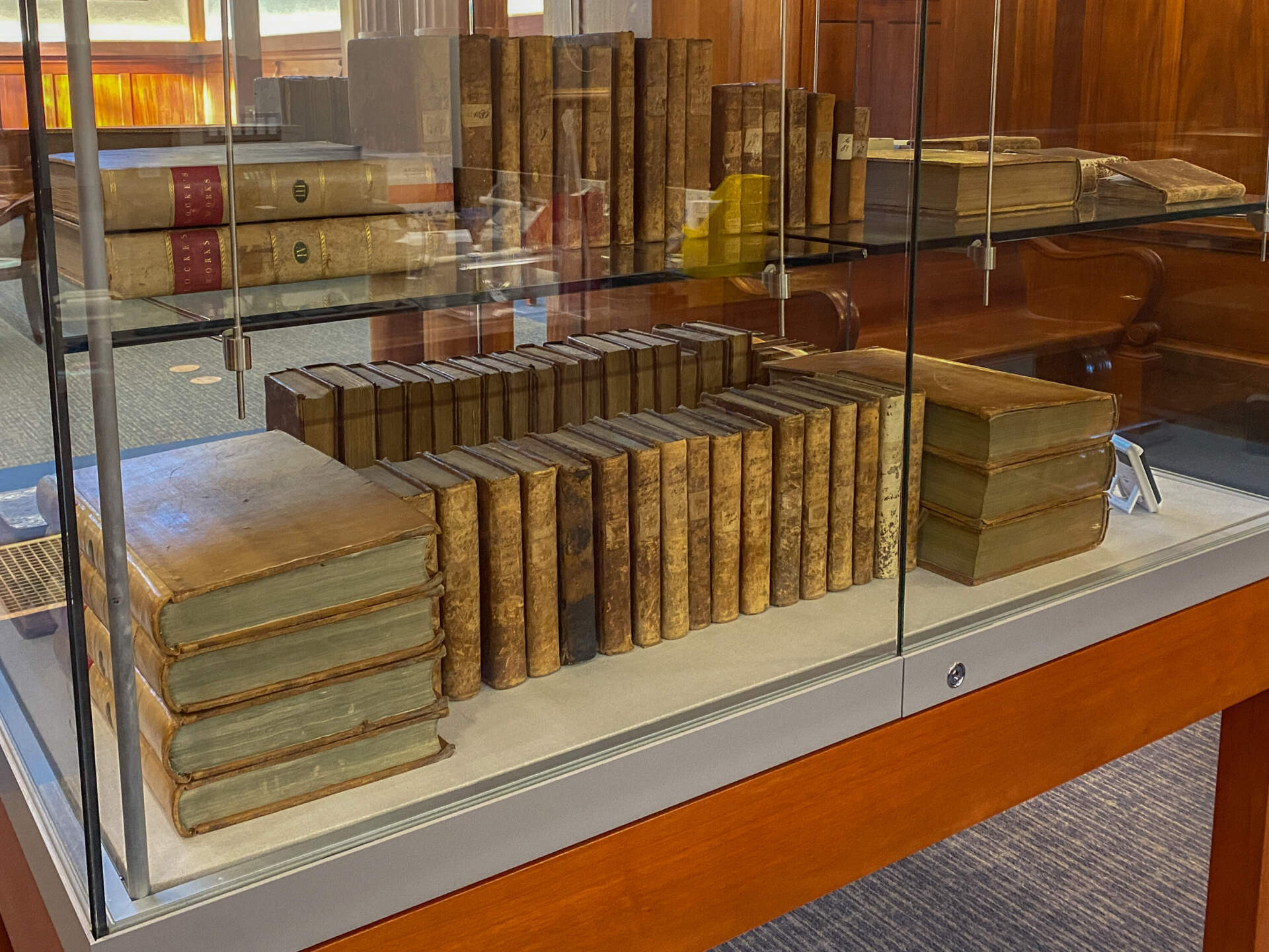 Books donated by Benjamin Franklin, on display in the Franklin Public Library. (Sharon Brody/WBUR)