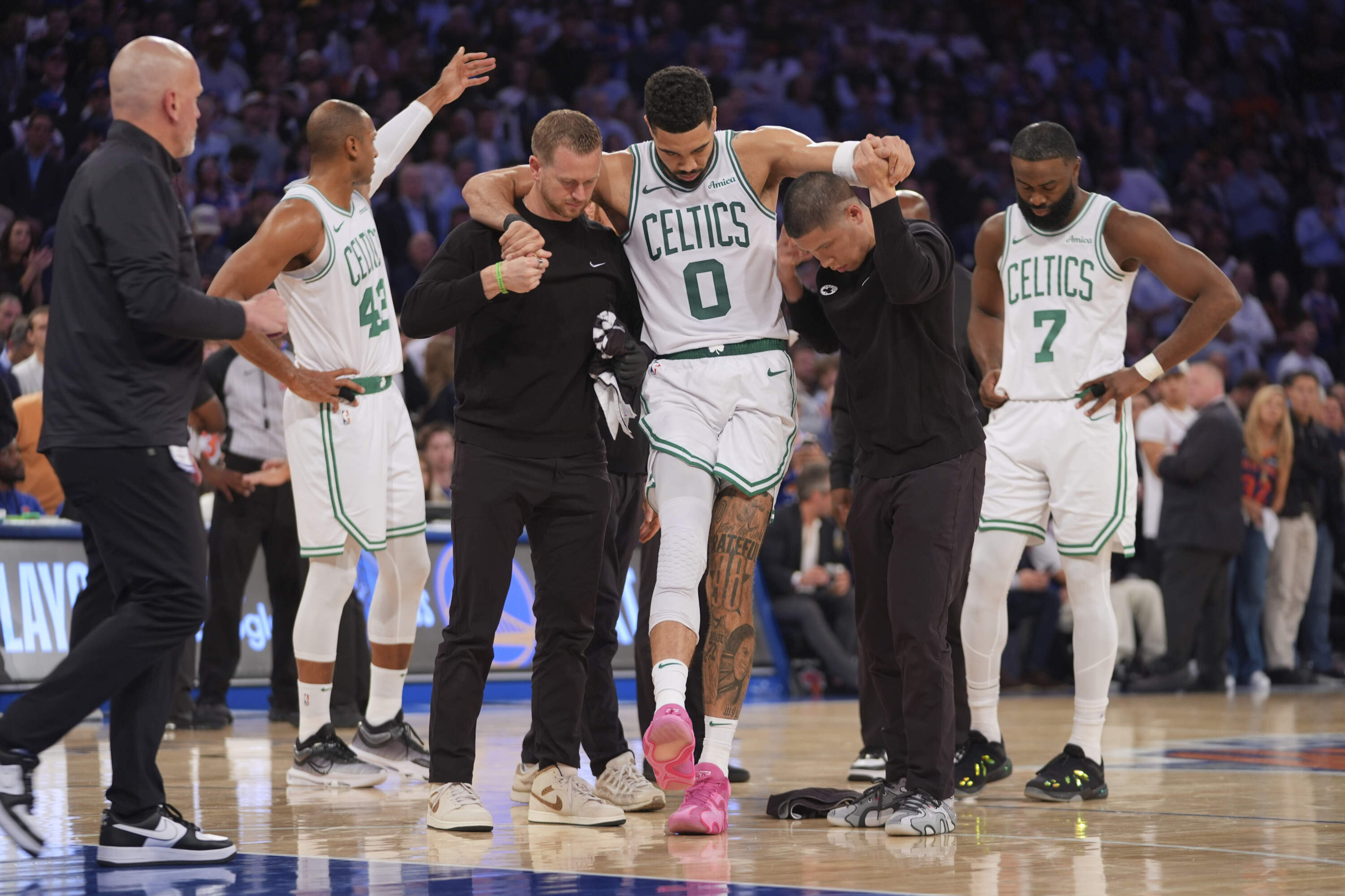 Trainers help Boston Celtics' Jayson Tatum off the court after he was injured during the second half of Game 4 in the Eastern Conference semifinals Monday, May 12, 2025, in New York. (Frank Franklin II/AP)
