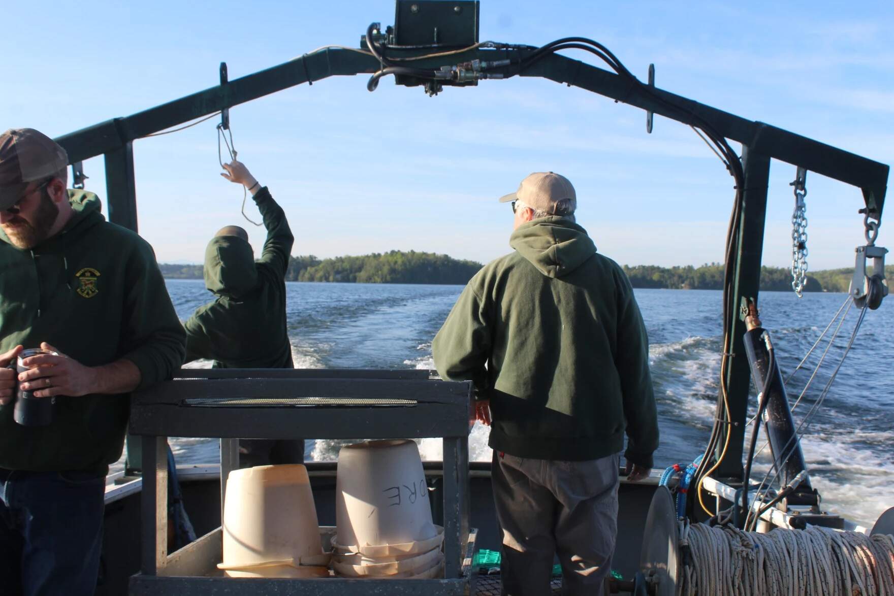 The crew readies the net and prepares to trawl for fish. (Abagael Giles/Vermont Public)