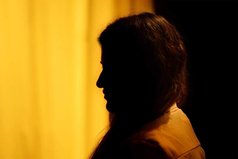 Karishma Ganjoo fled Kashmir when she was only one year-old. She now lives in Connecticut and asked to be photographed in a silhouetted profile out of concern for her safety April 29, 2025. (Mark Mirko/Connecticut Public)