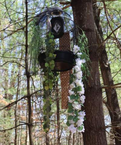 Ekua Holmes' “The Caged Bird” installed at Brister’s Hill in Walden Woods. (Courtesy The Umbrella Arts Center)