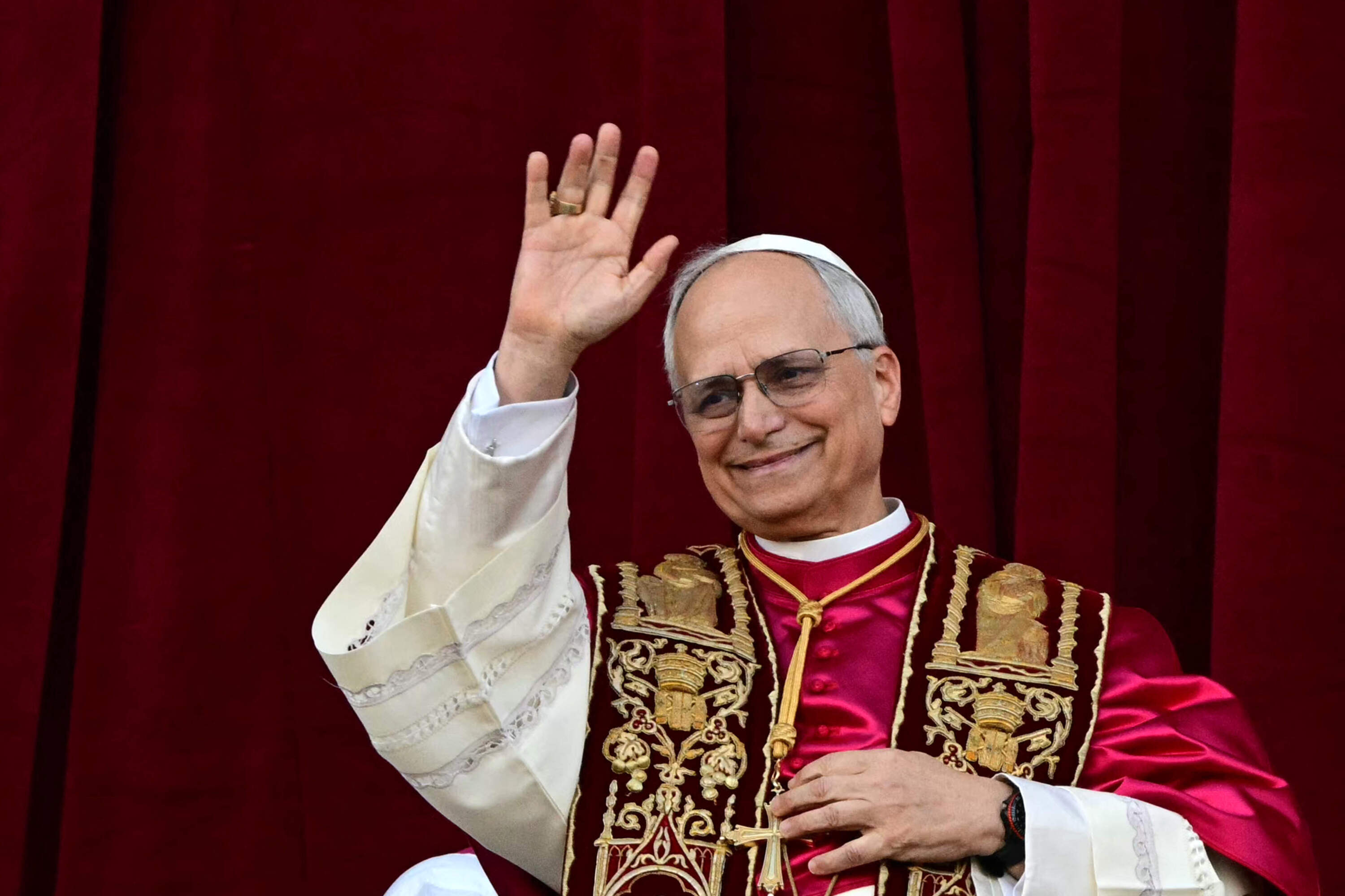 Newly elected Pope Leo XIV, Robert Prevost addresses the crowd from the main central loggia balcony of the St Peter's Basilica for the first time, after the cardinals ended the conclave, in The Vatican, on May 8, 2025. (Tiziana Fabi/AFP via Getty Images)