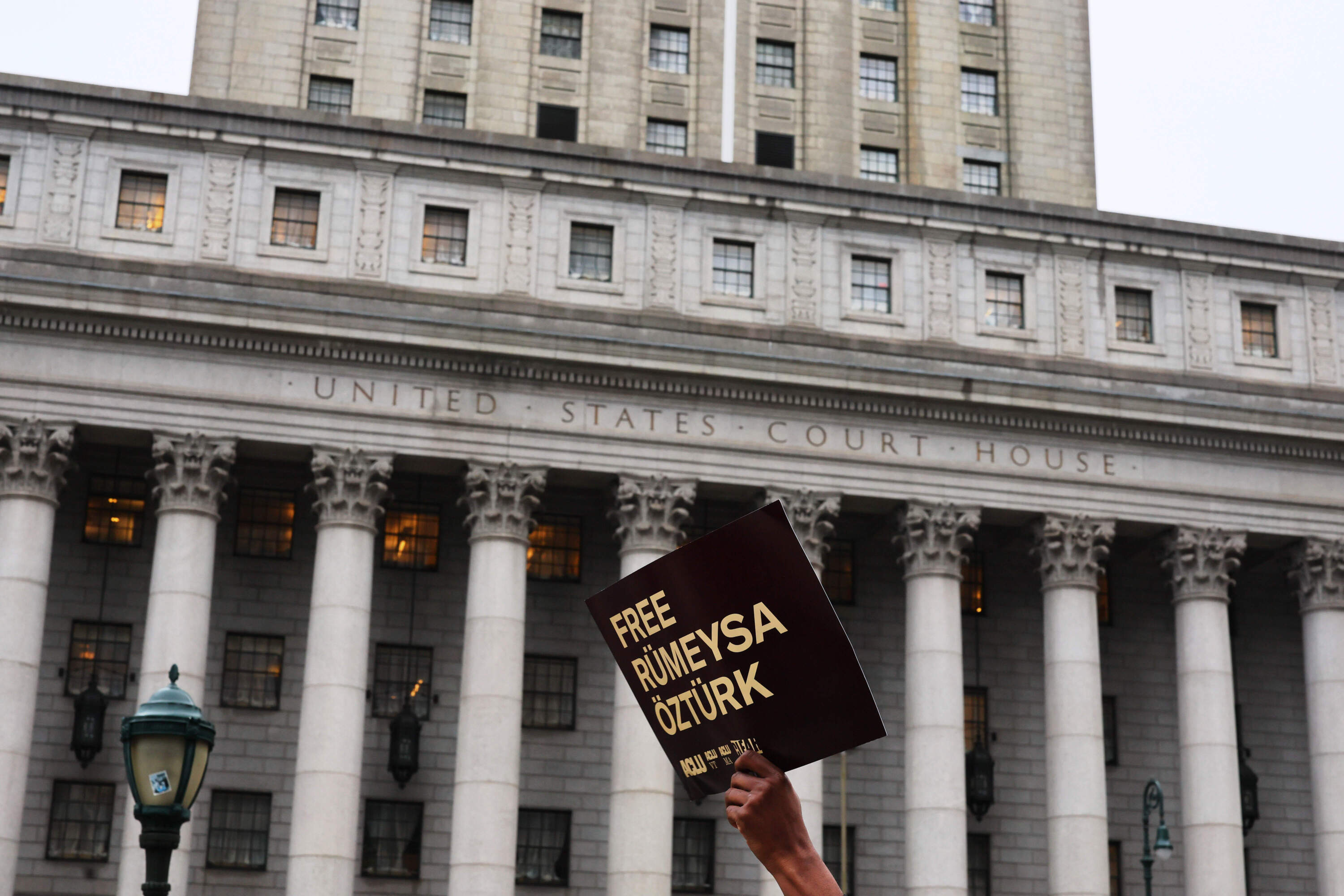 People gather for a rally in support of Tufts University student Rumeysa Ozturk and Columbia University student activist Mohsen Mahdawi in New York City. (Michael M. Santiago/Getty Images)