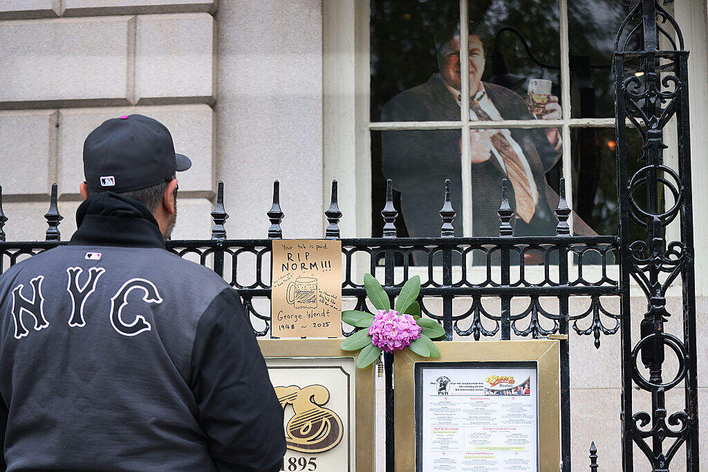 A note of condolence and flowers are in front of the Cheers Pub in honor of the late actor George Wendt who played Norm on the TV show Cheers. The actor was 76 years old. May 21, 2025. Boston, MA. (Photo by Suzanne Kreiter/The Boston Globe via Getty Images)