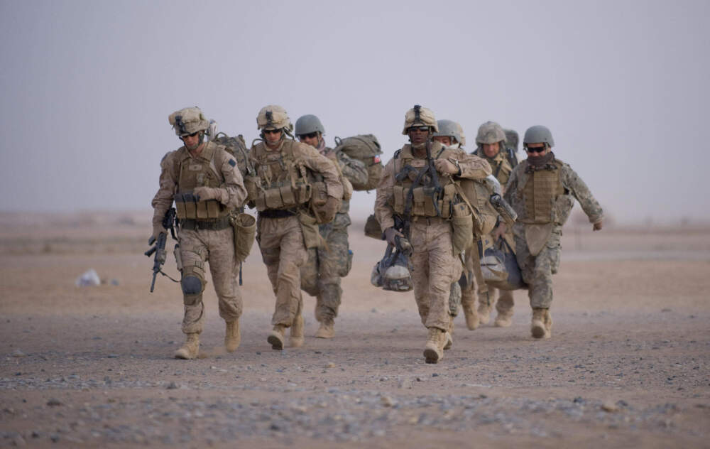 U.S. Marines from the 2nd Battalion, 8th Marine Regiment of the 2nd Marine Expeditionary Brigade walk towards helicopter transport as part of Operation Khanjar at Camp Dwyer in Helmand Province in Afghanistan on July 2, 2009. (Manpreet Romana/AFP via Getty Images)