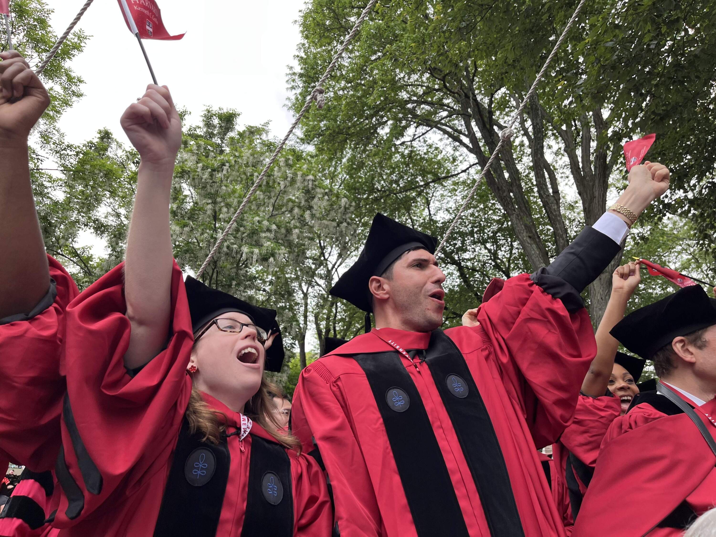 Harvard graduates celebrate during commencement on Thursday (Emily Piper-Vallillo/WBUR)