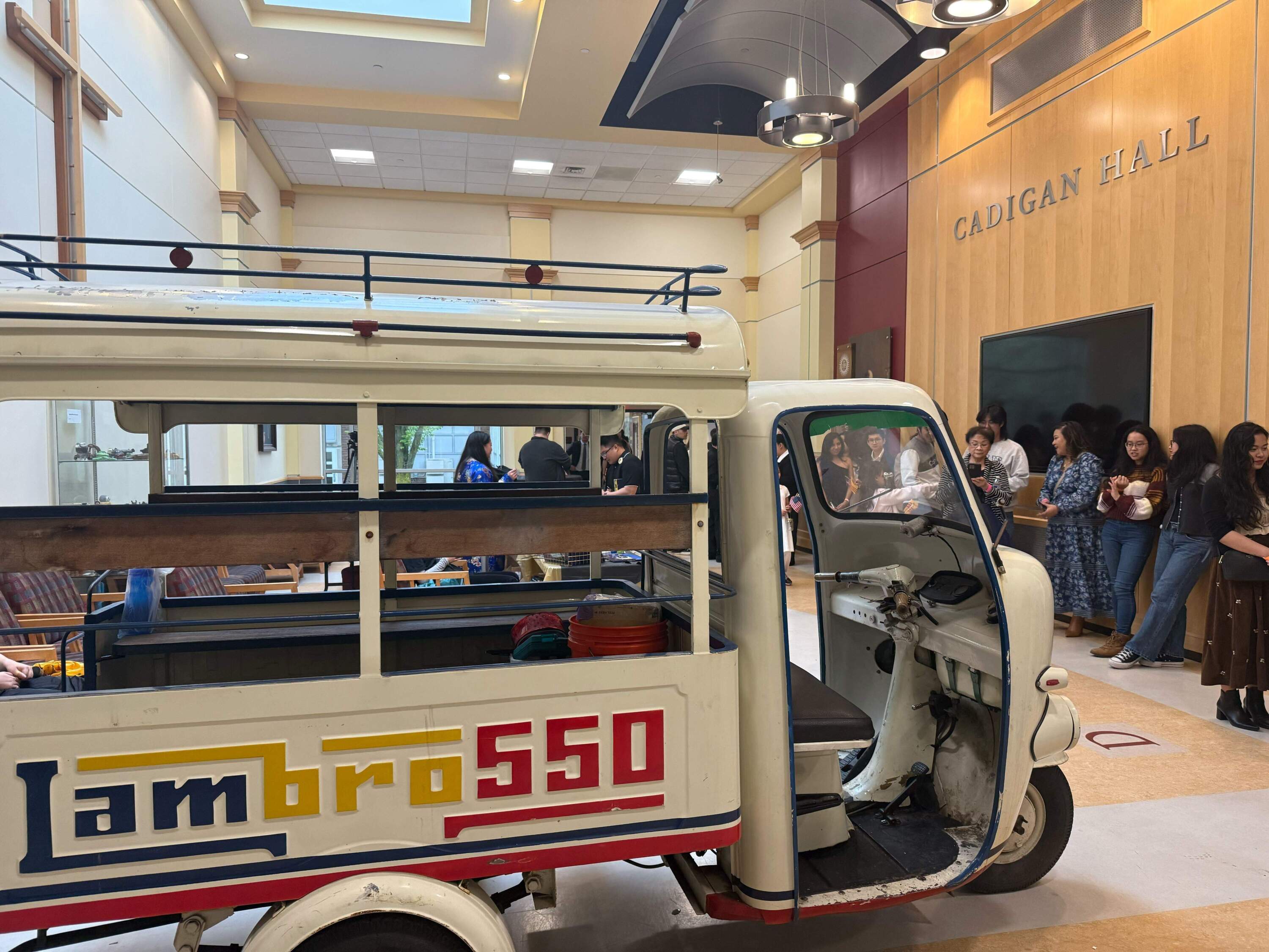 A line of people wait to enter an immersive exhibition offering insight into the movement and path of the Vietnamese diaspora since 1975. (Cristela Guerra/WBUR)