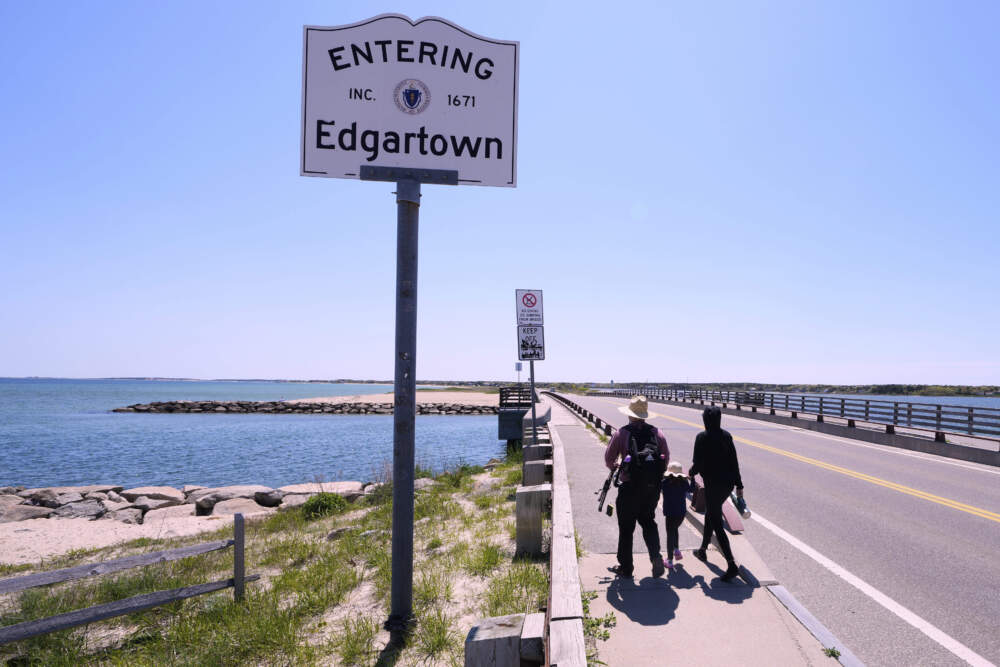 A family walks to the span of the American Legion Memorial Bridge, also known as the "Jaws Bridge", Monday, May 12, 2025, in Edgartown, Mass. (Charles Krupa/AP)