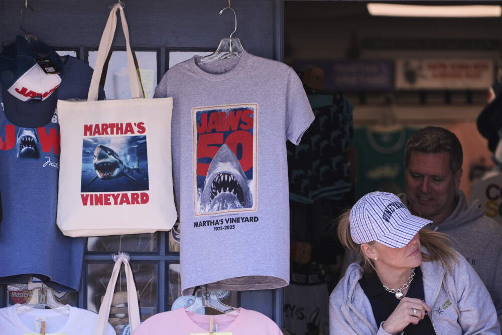 A shopper walks past items featuring the Jaws movie at Neptune's Sea Chest gift shop, Monday, May 12, 2025, in Vineyard Haven, Mass. (Charles Krupa/AP)