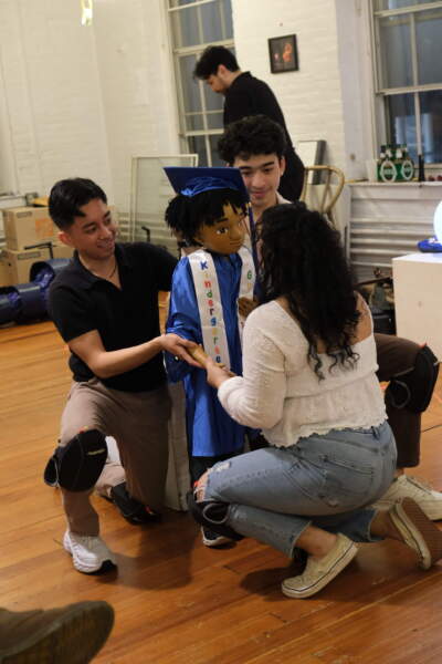 Actors with Eddie the puppet during rehearsal for "Learning How to Read by Moonlight." (Courtesy Jenny S. Lee/CHUANG Stage)