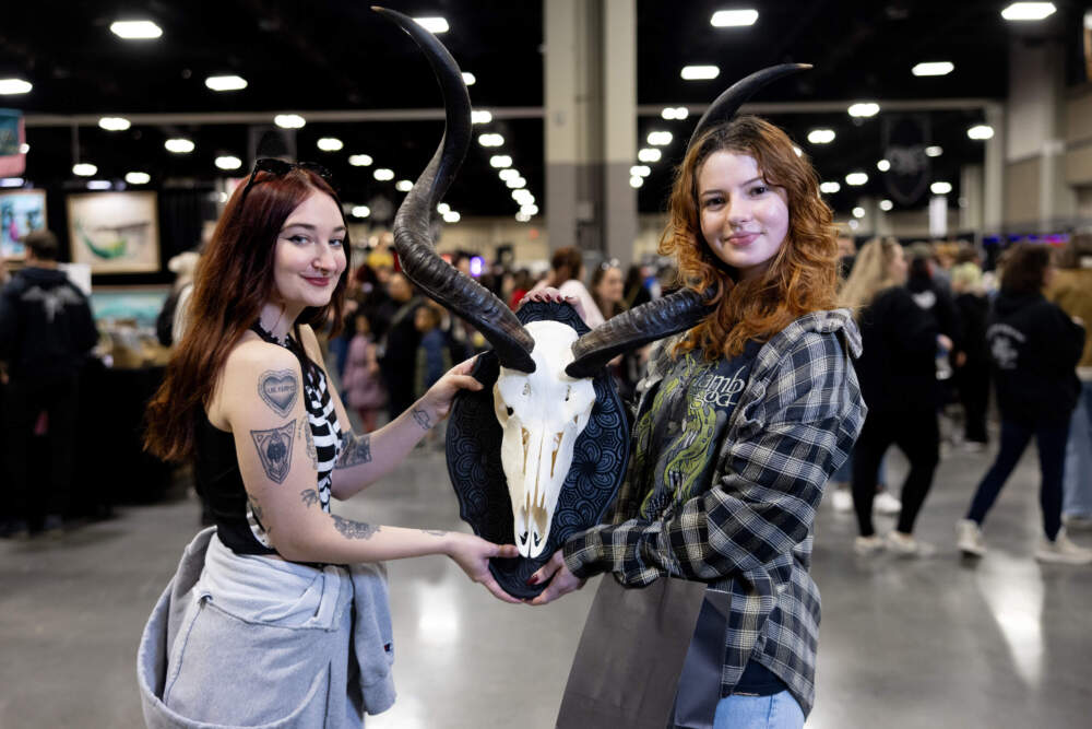 Two expo attendees pose with a mounted skull. (Courtesy of Michelle Cozzaglio)