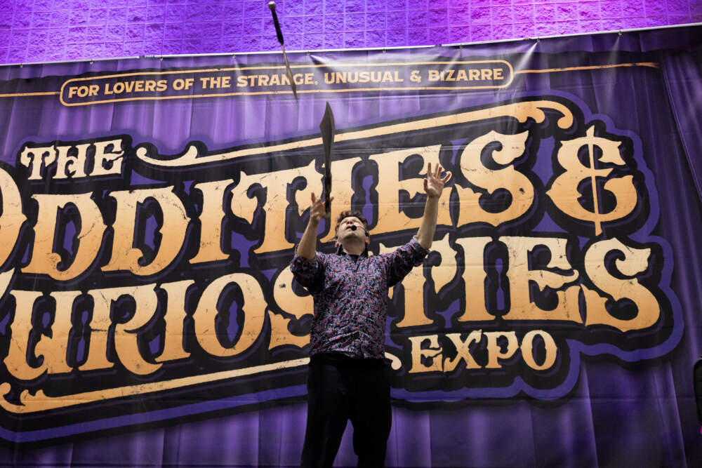 Performer Brent Fiasco juggles daggers during the expo's circus sideshow. (Courtesy of Michelle Cozzaglio)