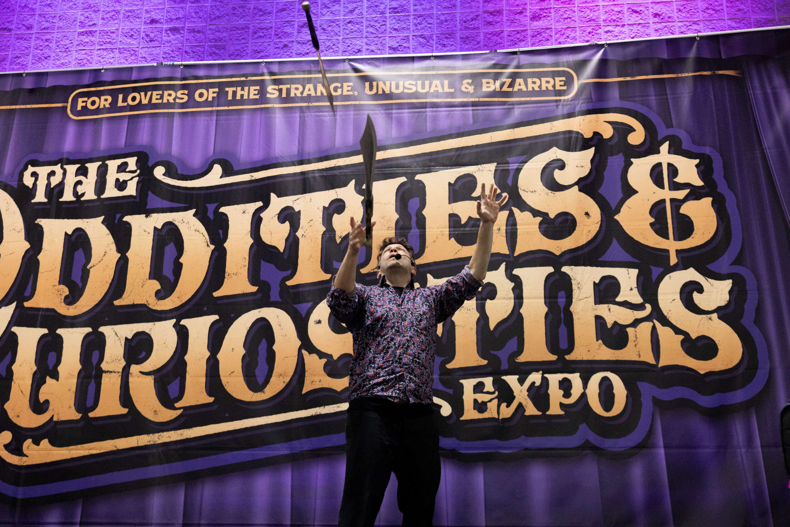 Performer Brent Fiasco juggles daggers during the expo's circus sideshow. (Courtesy of Michelle Cozzaglio)
