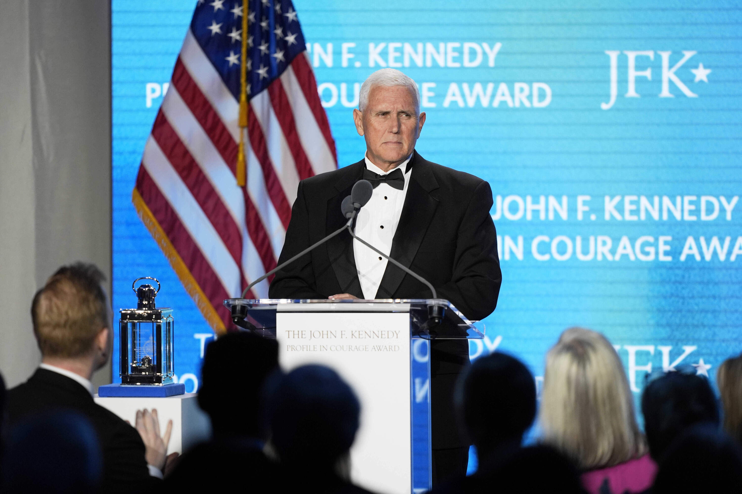 Former Vice President Mike Pence acknowledges a standing ovation as he speaks after receiving the John F. Kennedy Profile in Courage Award during a ceremony at the JFK Library, Sunday, May 4, 2025, in Boston. (Robert F. Bukaty/AP)