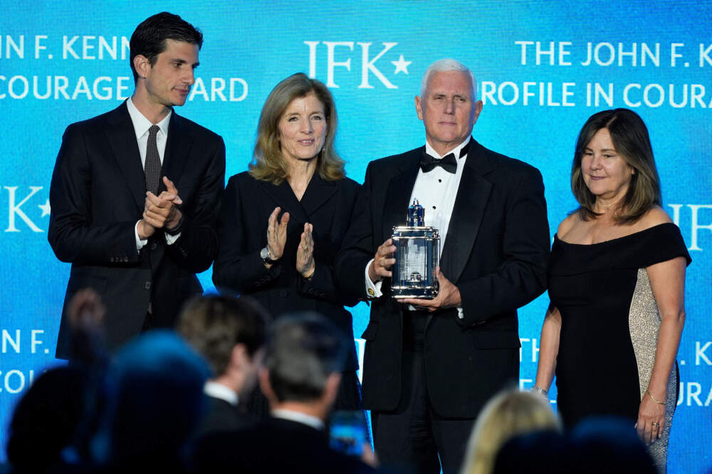 Former Vice President Mike Pence, second from right, stands with his wife, Karen Pence, far right, as he is presented with the John F. Kennedy Profile in Courage Award by Jack Schlossberg and his mother, Caroline Kennedy. (Robert F. Bukaty/AP)