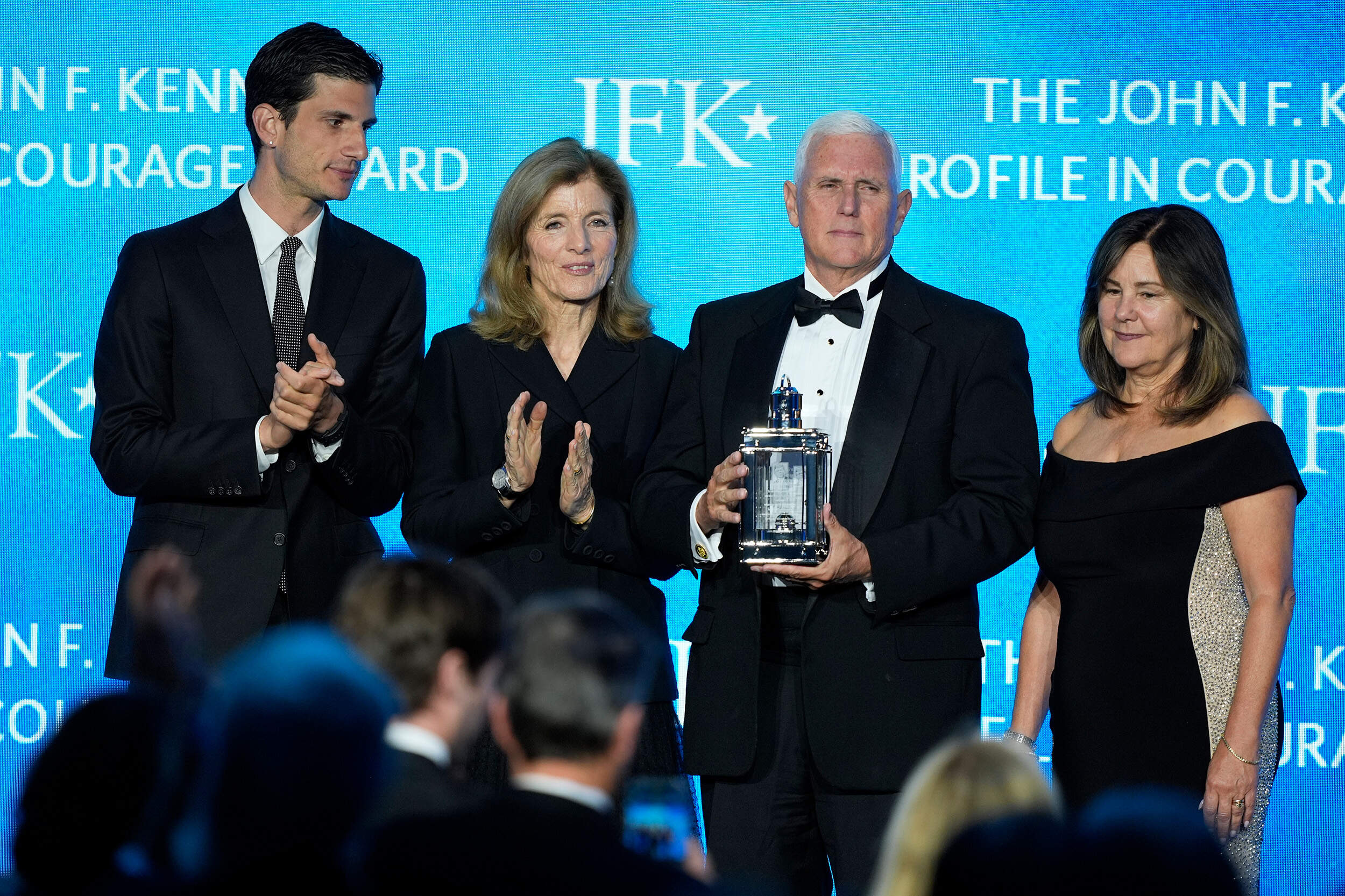 Former Vice President Mike Pence, second from right, stands with his wife, Karen Pence, far right, as he is presented with the John F. Kennedy Profile in Courage Award by Jack Schlossberg and his mother, Caroline Kennedy. (Robert F. Bukaty/AP)