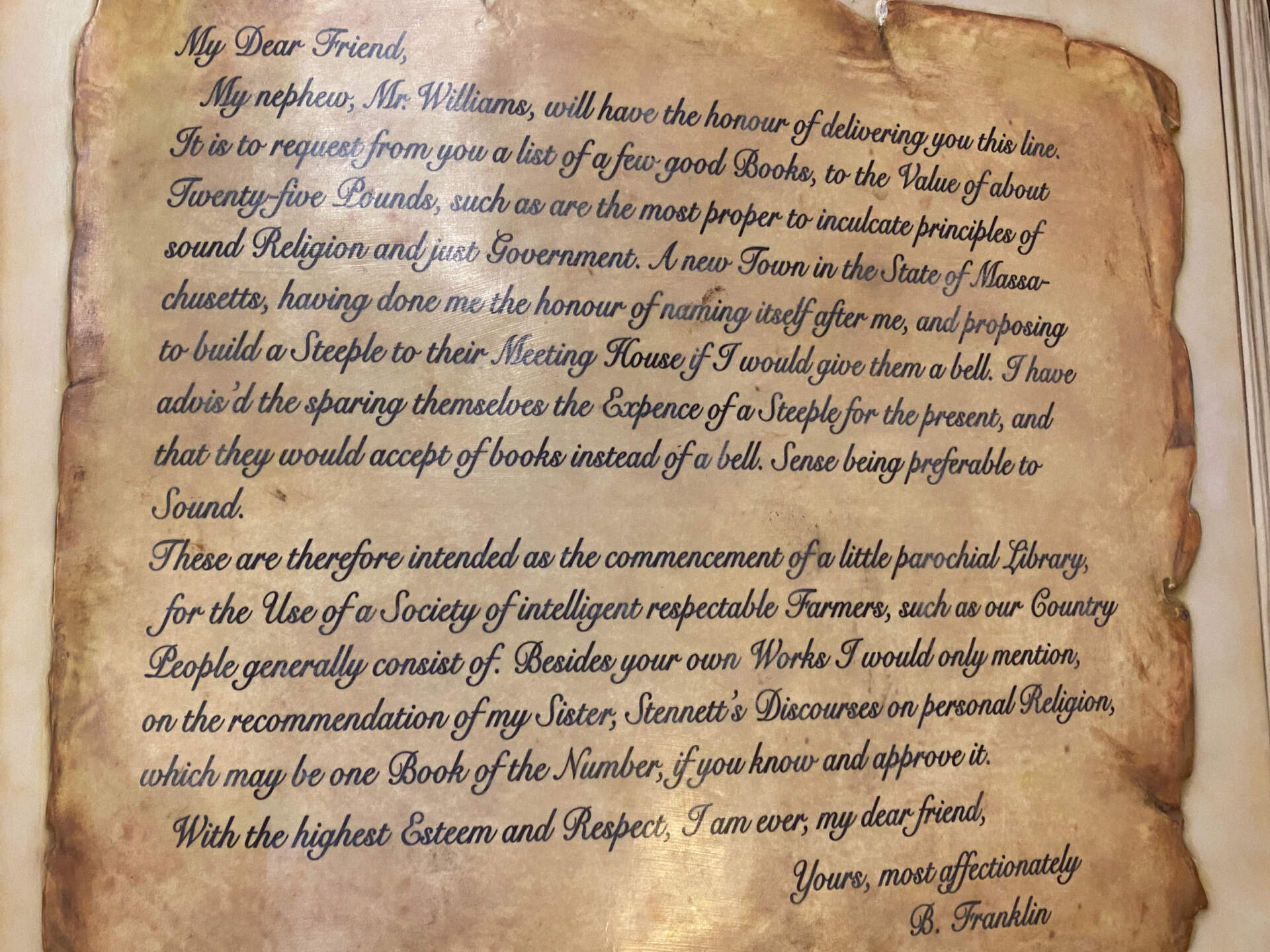 The Franklin Public Library displays a re-creation of the letter sent by Benjamin Franklin that set in motion the gift that established the first free lending library in America. (Sharon Brody/WBUR)
