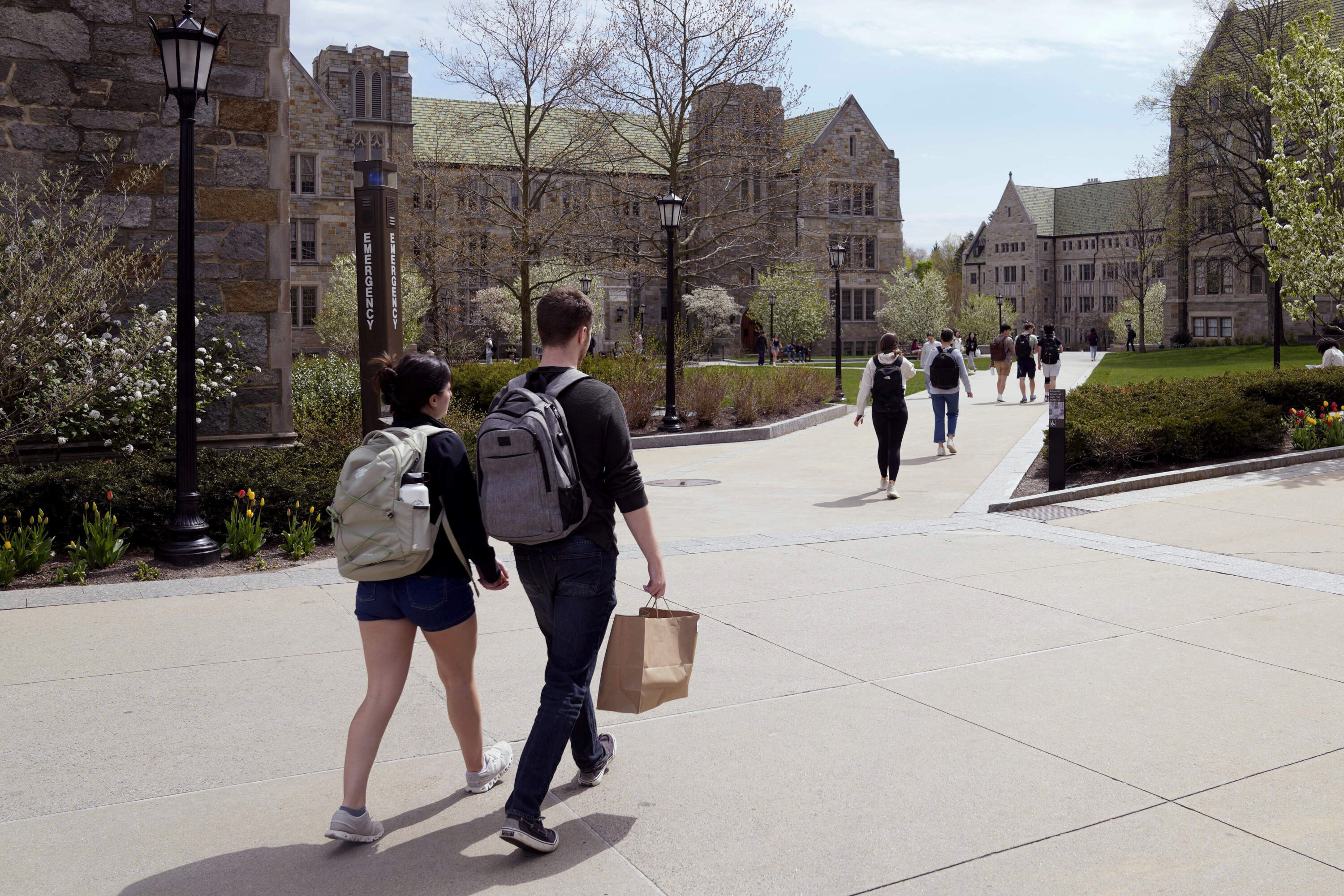 Students walk on the campus of Boston College on April 29, 2024, in Boston. (Charles Krupa/AP file photo)