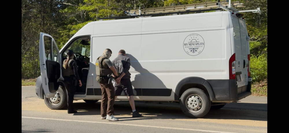 Federal officers take a man into custody on Martha's Vineyard on May 27, 2025. (Courtesy of Circuit Arts via Vineyard Gazette)