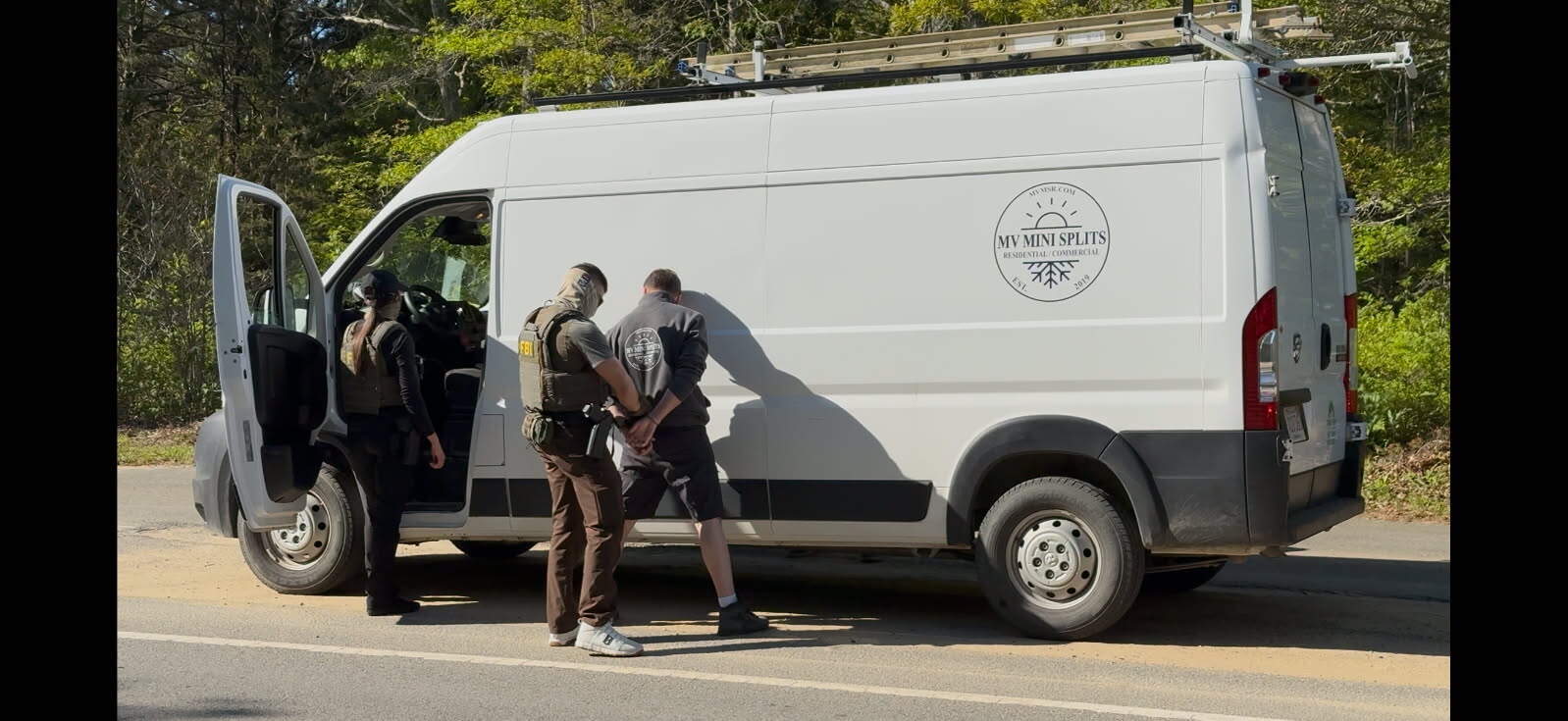 Federal officers take a man into custody on Martha's Vineyard on May 27, 2025. (Courtesy of Circuit Arts via Vineyard Gazette)