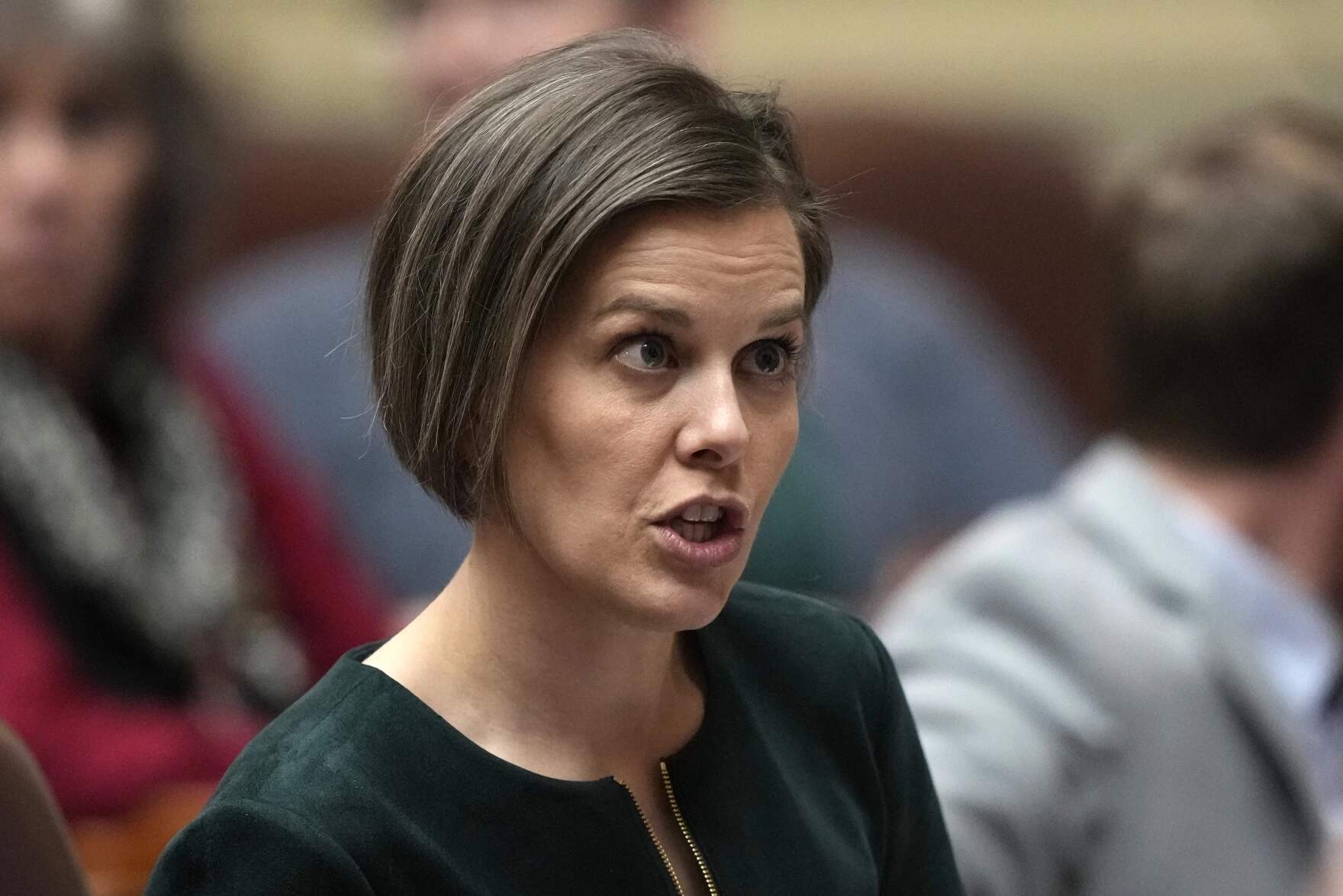 State Rep. Laurel Libby, R-Auburn, speaks with a colleague, Feb. 14, 2023, at the State House in Augusta, Maine. (Robert F. Bukaty/AP)