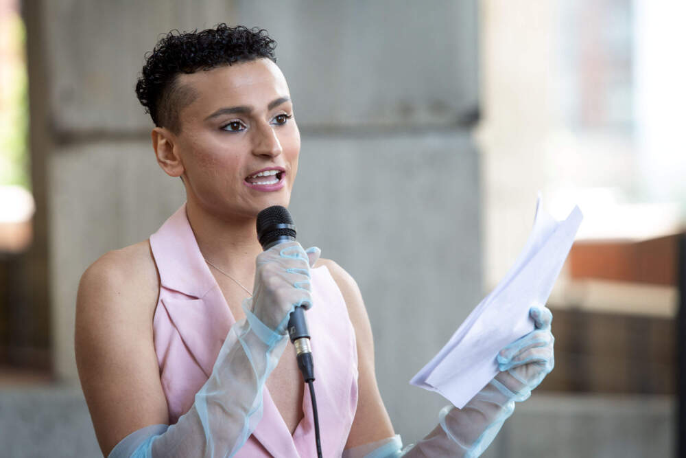 Muhammad Burhan speaks at the Pride flag raising event at Boston City Hall. (Robin Lubbock/WBUR)