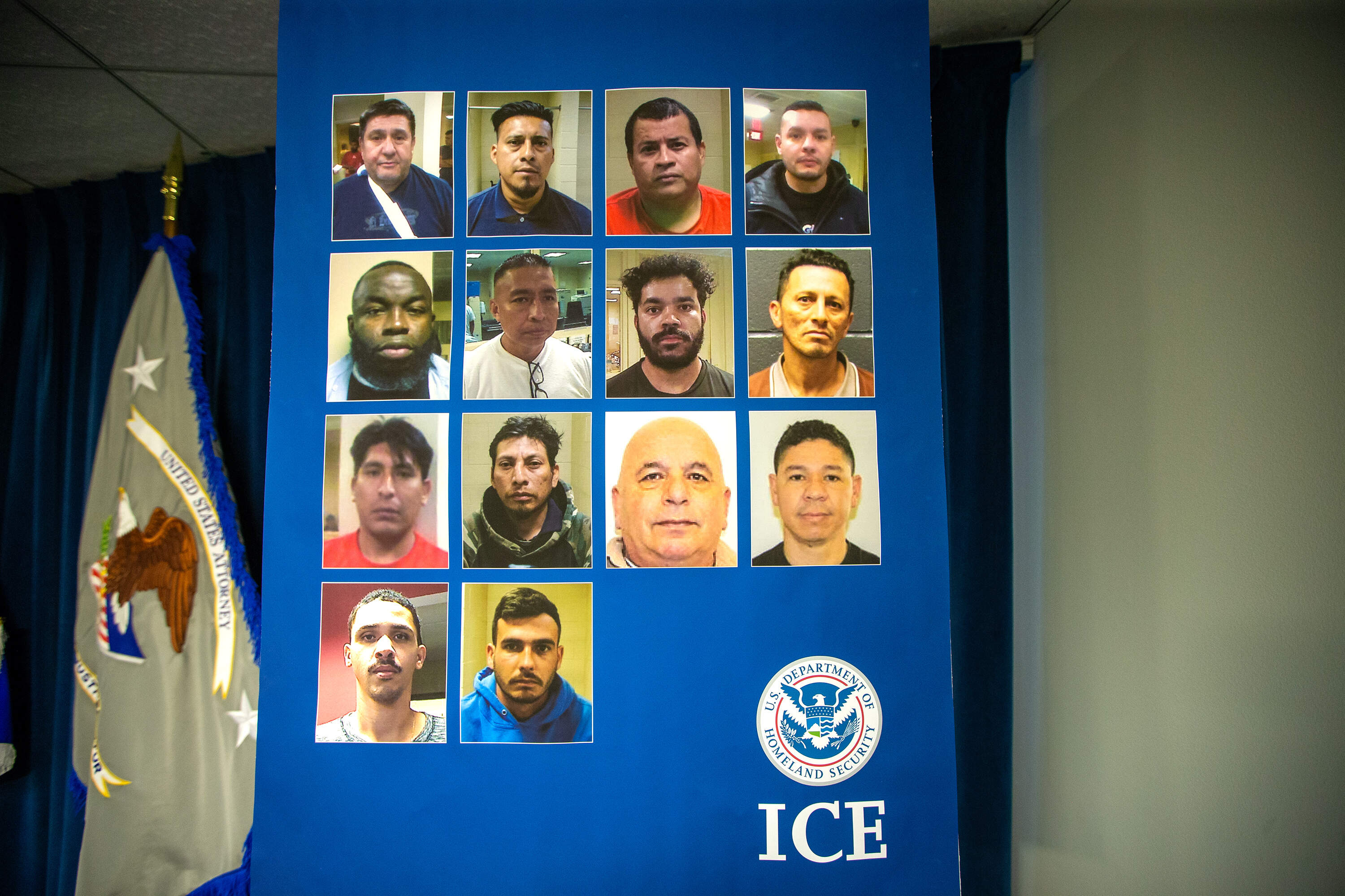 A poster with photographs of individuals who have been apprehended by ICE in the past month in Massachusetts. (Jesse Costa/WBUR)