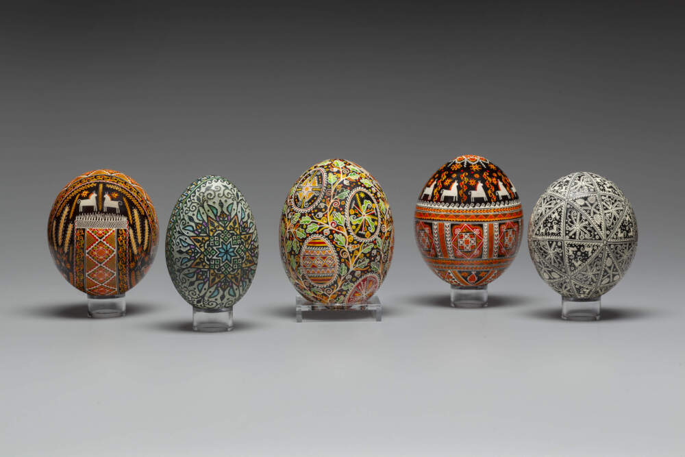 From left: Pasha Plytorak, "Pysanka," 2025; Tetyana Konovalm, "Pysanka," 2023; Svitlana Stadnyk family, "Pysanka," 2017; Pasha Plytorak, "Pysanka," 2025; and Svitlana Stadnyk family, "Pysanka," 2017. (Courtesy Will Howcroft/Fuller Craft Museum)